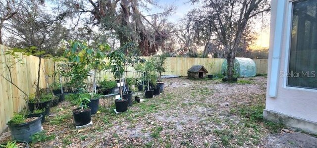 view of yard with a fenced backyard