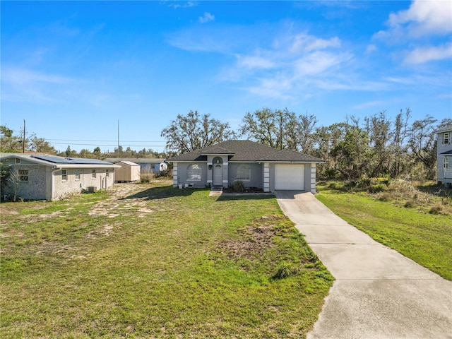 view of front facade with driveway, an attached garage, and a front lawn