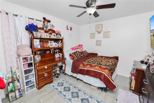 bedroom with light wood-style floors and ceiling fan