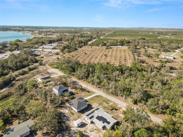 drone / aerial view featuring a rural view and a water view