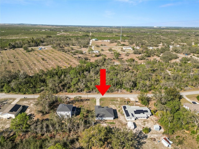 birds eye view of property featuring a rural view