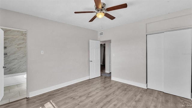 unfurnished bedroom with baseboards, ceiling fan, a closet, and light wood-style floors