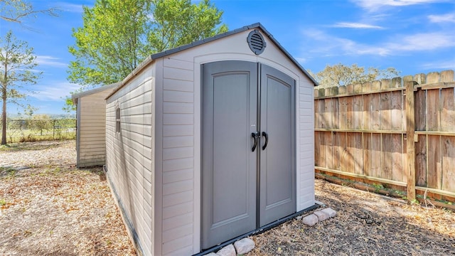 view of shed featuring a fenced backyard