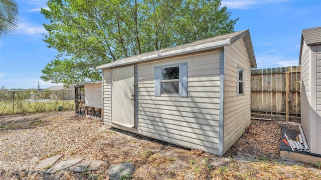 view of shed with fence