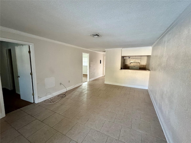 unfurnished room featuring visible vents, crown molding, baseboards, a textured wall, and a textured ceiling