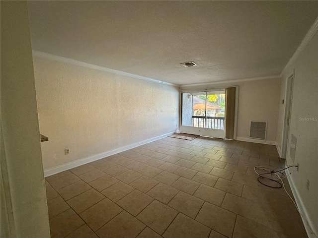 spare room featuring visible vents, baseboards, a textured ceiling, and ornamental molding