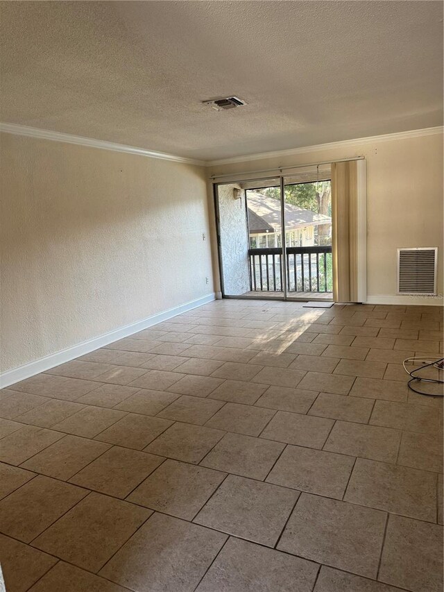141 Fernery Rd Unit B5, Lakeland, FL 33809 - unfurnished room featuring baseboards, crown molding, a textured ceiling, and visible vents