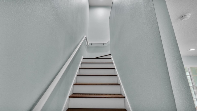 stairs with a textured wall