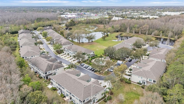 bird's eye view with a water view and a residential view