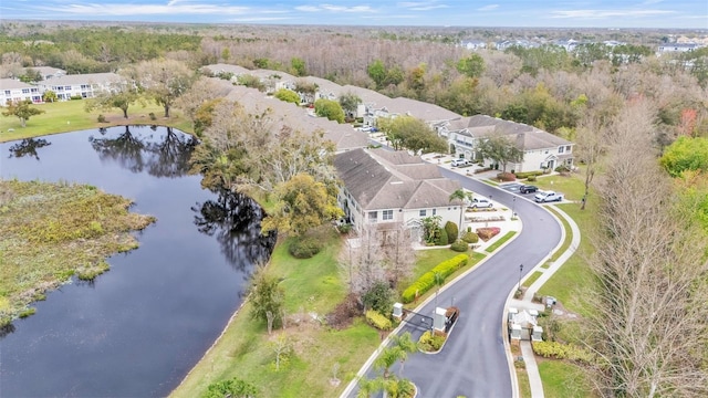 birds eye view of property featuring a water view and a residential view