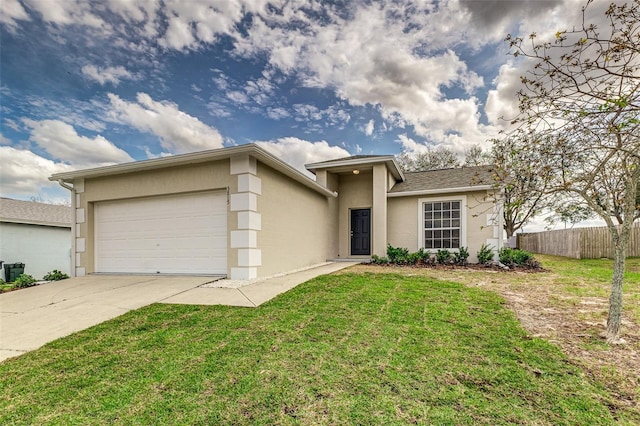 view of front of home with a front yard, fence, driveway, and stucco siding