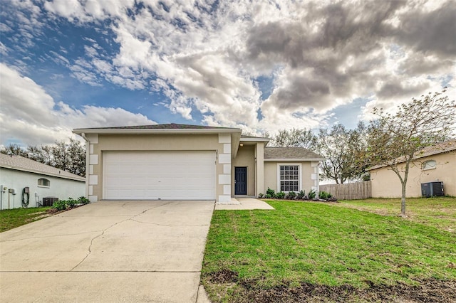 view of front of home featuring central AC unit, a garage, concrete driveway, stucco siding, and a front yard