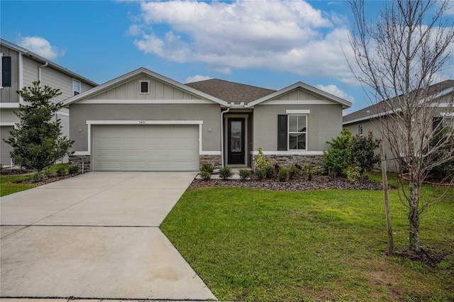 view of front of house featuring a front lawn, an attached garage, stone siding, and concrete driveway