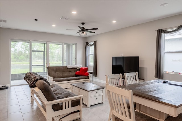 living room featuring light tile patterned floors, visible vents, baseboards, recessed lighting, and ceiling fan