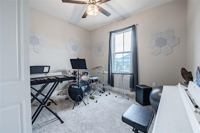 office featuring baseboards, carpet floors, and a ceiling fan