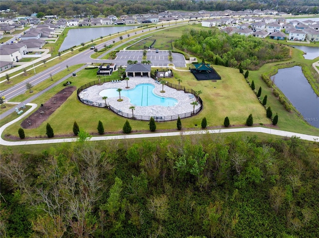 bird's eye view featuring a water view and a residential view