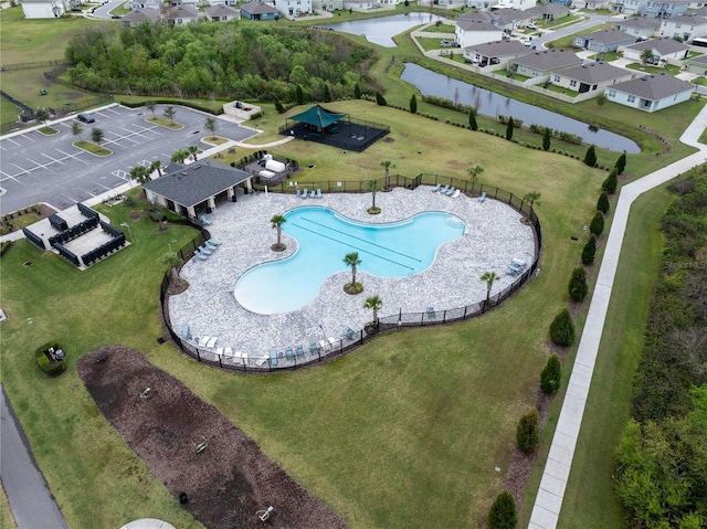 bird's eye view with a water view and a residential view