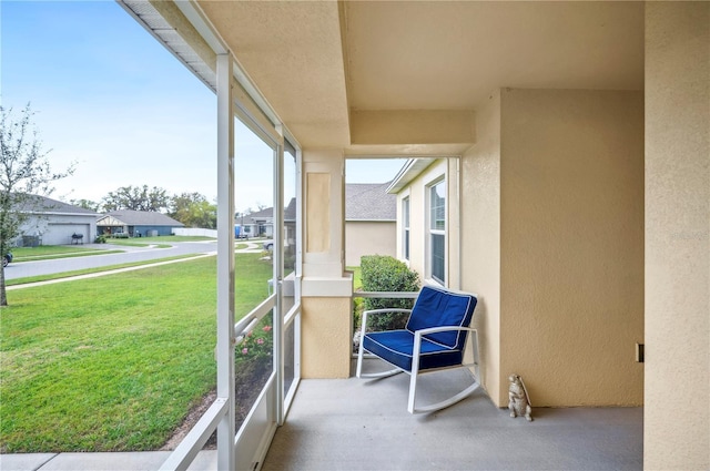 sunroom with a residential view