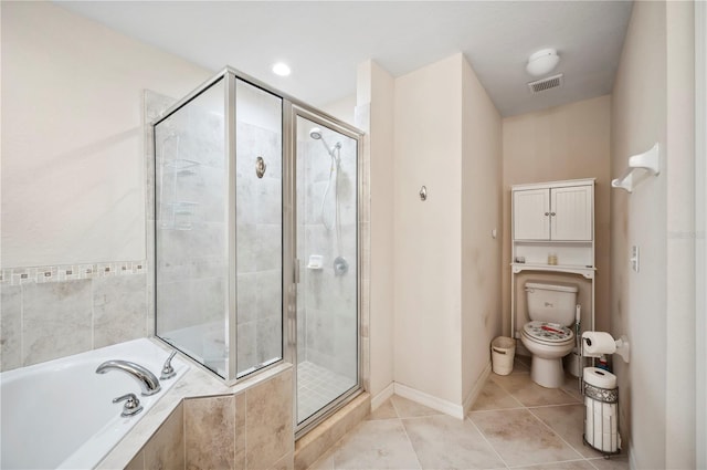 full bath with visible vents, toilet, a stall shower, a bath, and tile patterned floors