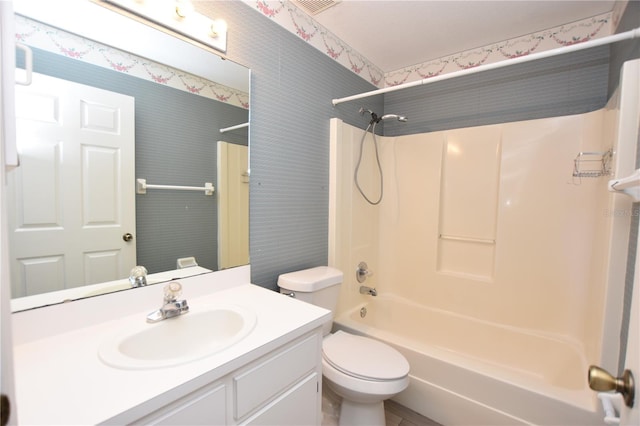 full bathroom with shower / bathtub combination, vanity, toilet, and wallpapered walls