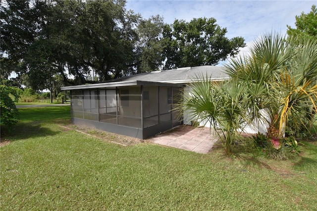 view of outbuilding with a sunroom