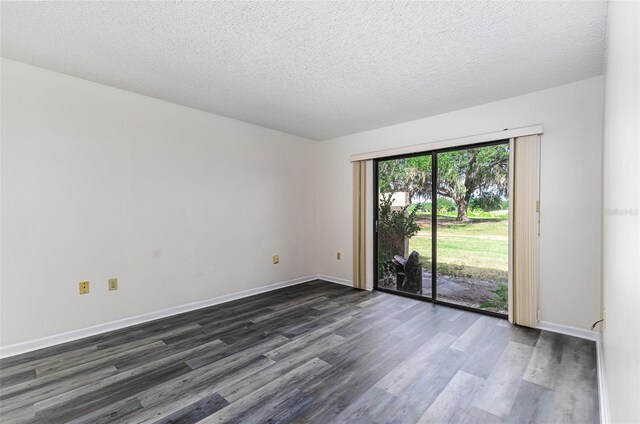 unfurnished room featuring a textured ceiling, baseboards, and dark wood-style floors
