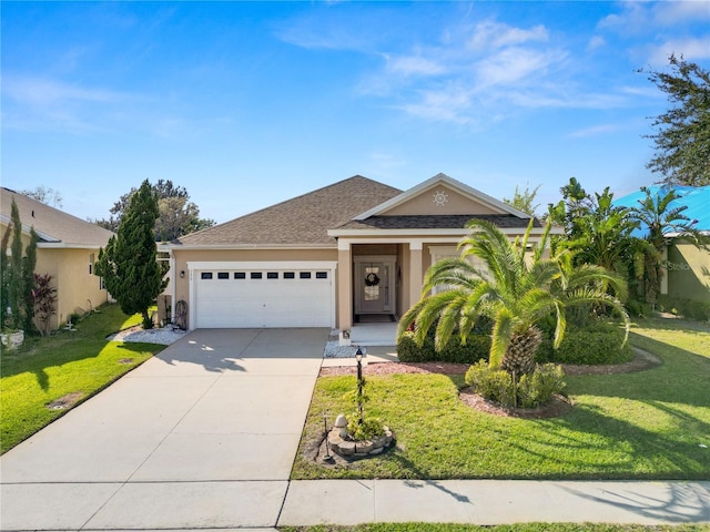 view of front facade featuring driveway, a front lawn, an attached garage, and stucco siding