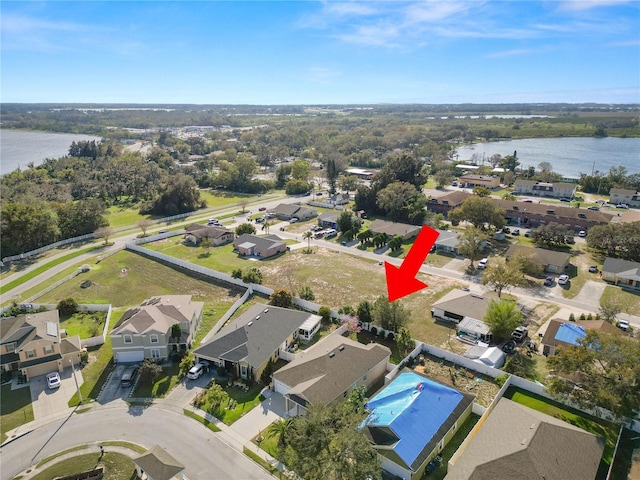 aerial view with a water view and a residential view