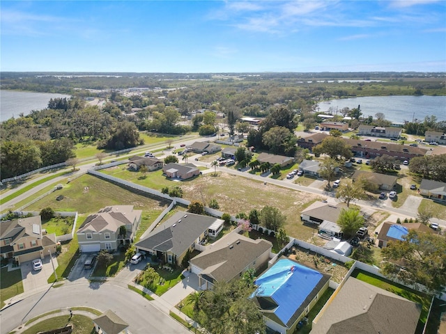 bird's eye view featuring a residential view and a water view