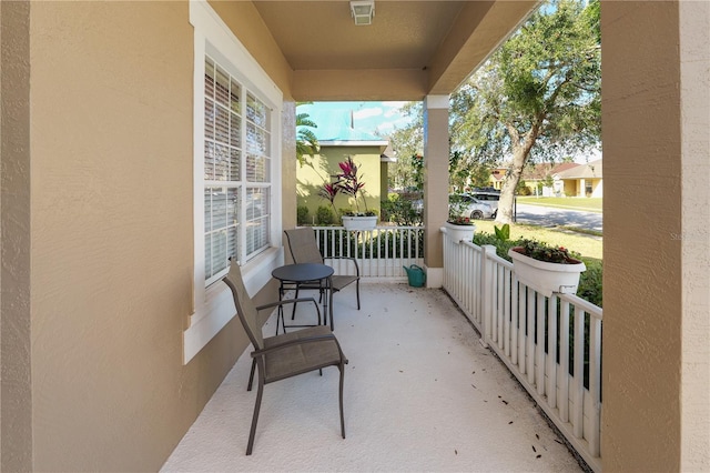 balcony with covered porch and visible vents