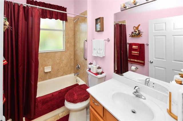 bathroom with vanity, toilet, and shower / tub combo with curtain