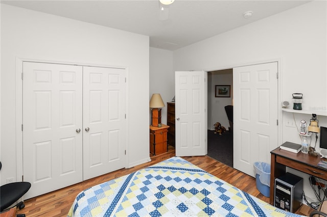 bedroom with a closet, wood finished floors, and a ceiling fan