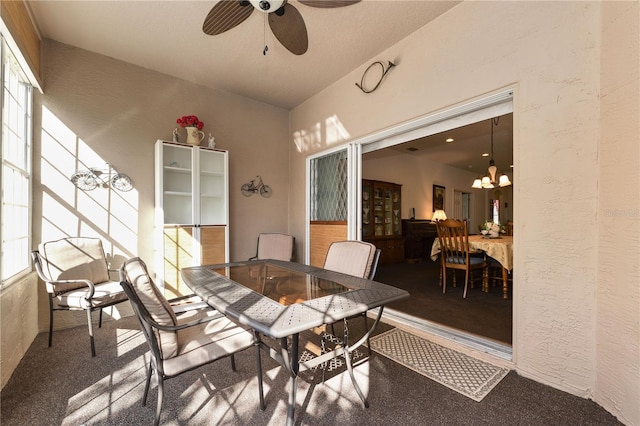 view of patio featuring a ceiling fan and outdoor dining space