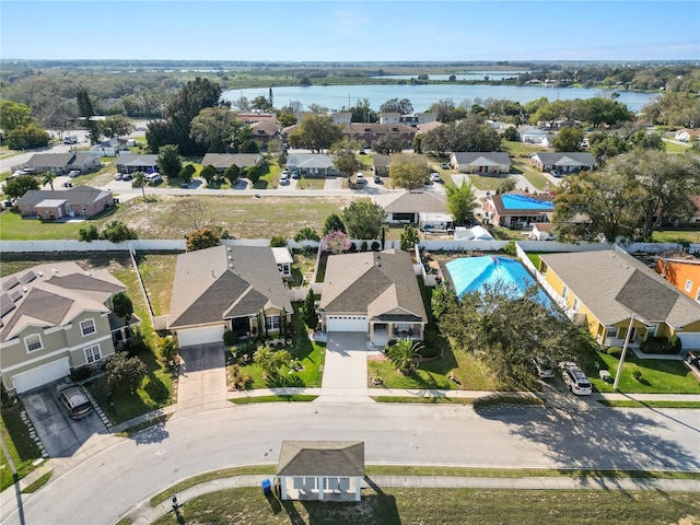 aerial view featuring a water view and a residential view