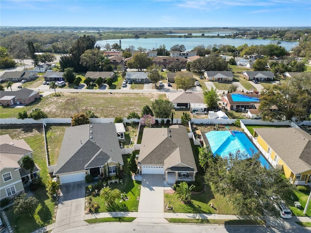 bird's eye view featuring a water view and a residential view