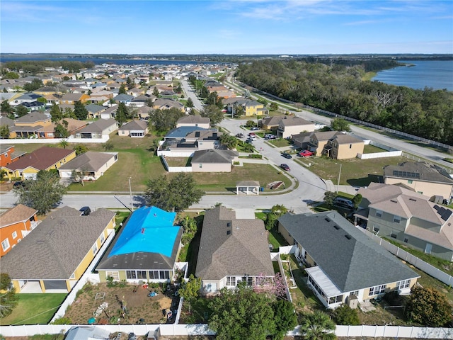 aerial view featuring a water view and a residential view