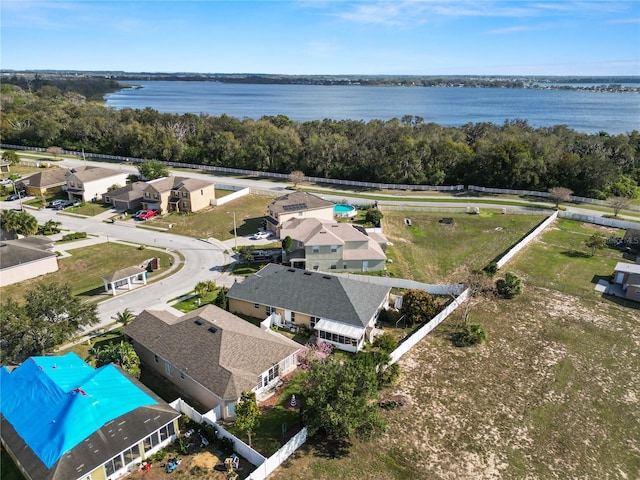 drone / aerial view with a residential view and a water view