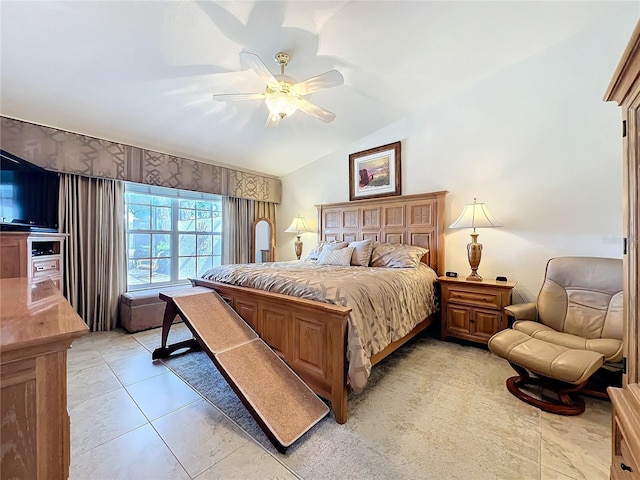 bedroom with lofted ceiling, ceiling fan, and light tile patterned floors