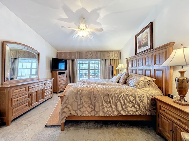 bedroom with lofted ceiling and ceiling fan