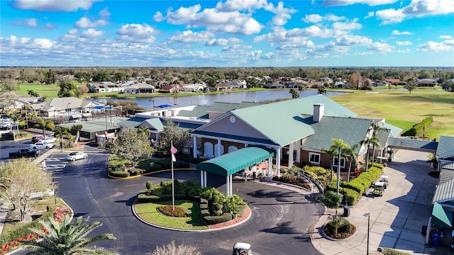 birds eye view of property featuring a water view and a residential view