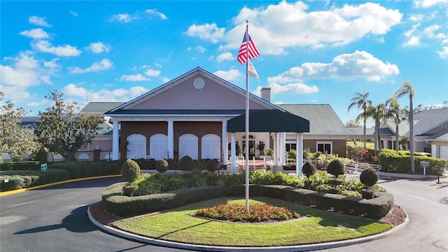 view of building exterior featuring aphalt driveway