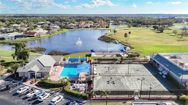 birds eye view of property featuring a residential view, view of golf course, and a water view