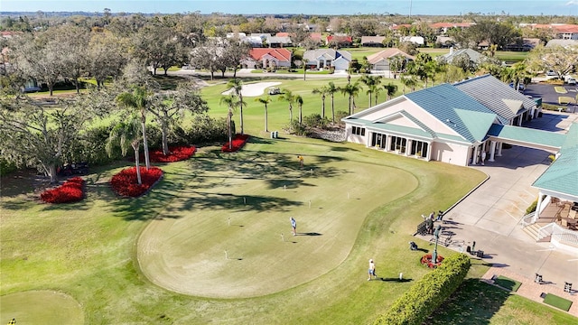 drone / aerial view featuring golf course view and a residential view