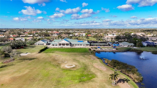 drone / aerial view with a residential view and a water view