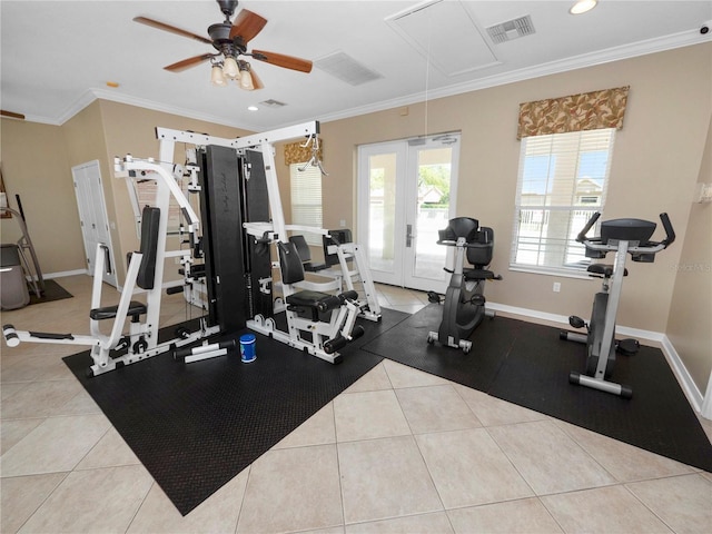 workout area with light tile patterned floors, visible vents, attic access, ornamental molding, and baseboards