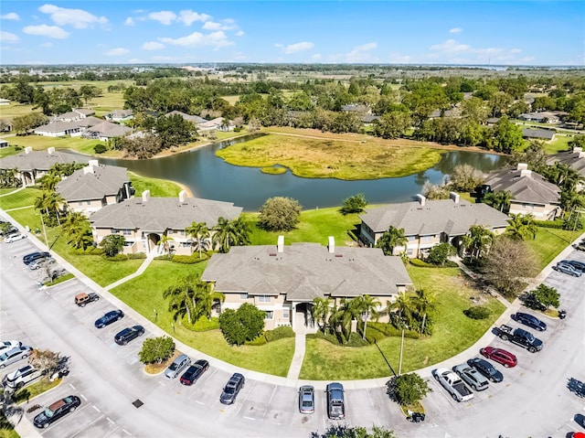 aerial view featuring a residential view and a water view