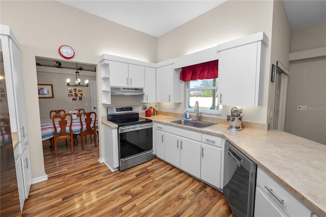 kitchen with stainless steel appliances, light wood-type flooring, under cabinet range hood, white cabinetry, and a sink