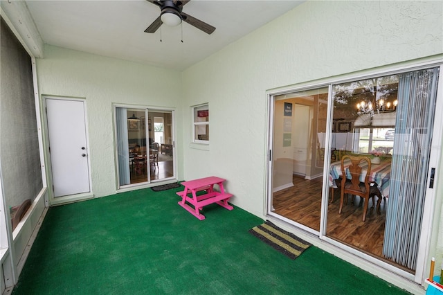 sunroom / solarium with a ceiling fan