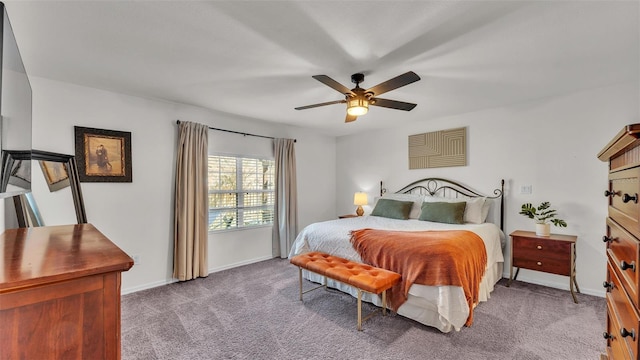 bedroom with ceiling fan, carpet floors, and baseboards