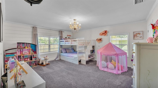 carpeted bedroom featuring ornamental molding, a chandelier, and visible vents